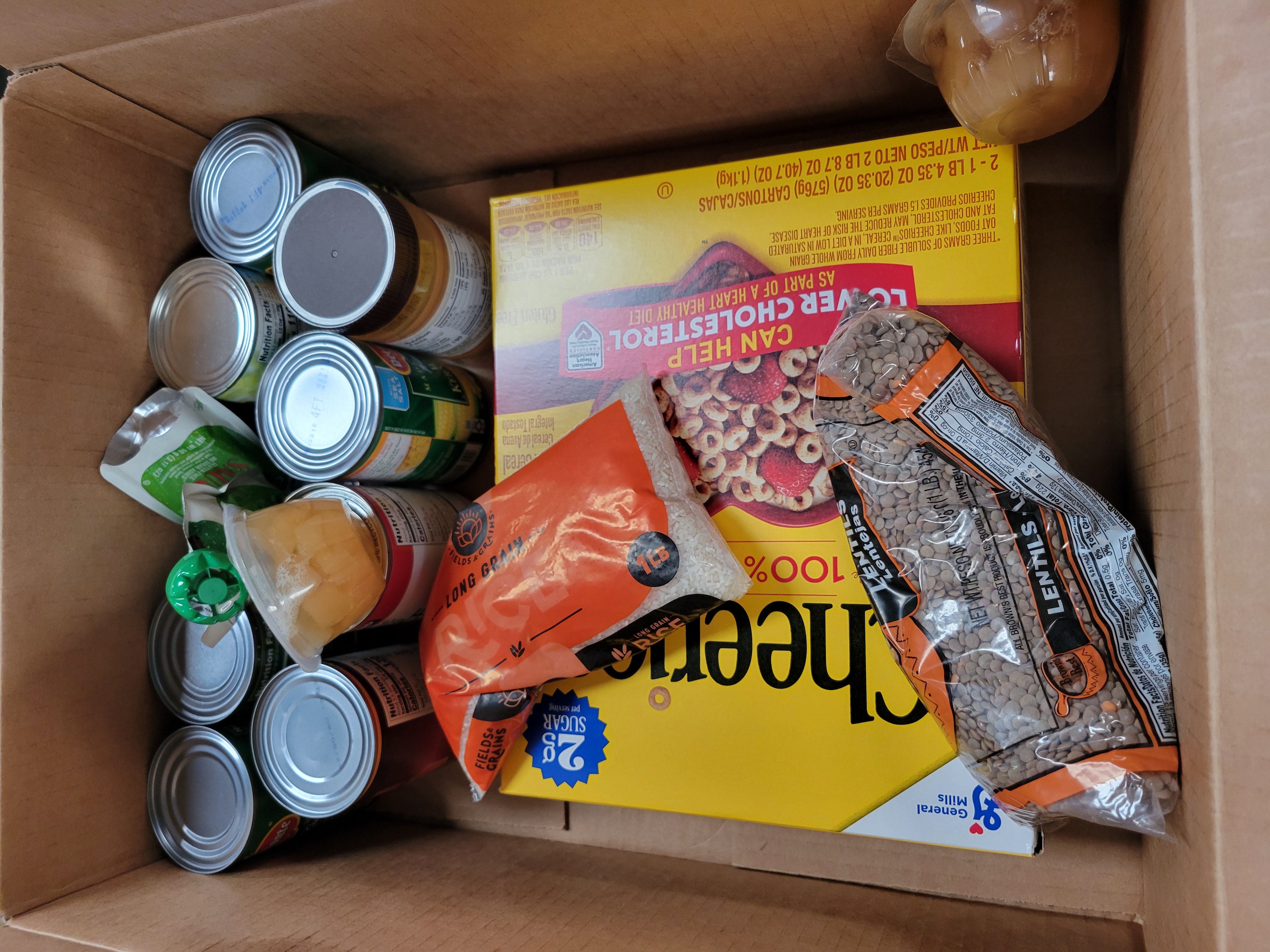 Cardboard box full of dry goods.